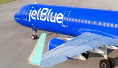 JetBlue Airbus A321 aircraft in blue Mint livery parked on runway