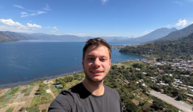 A man taking a selfie above a landscape.