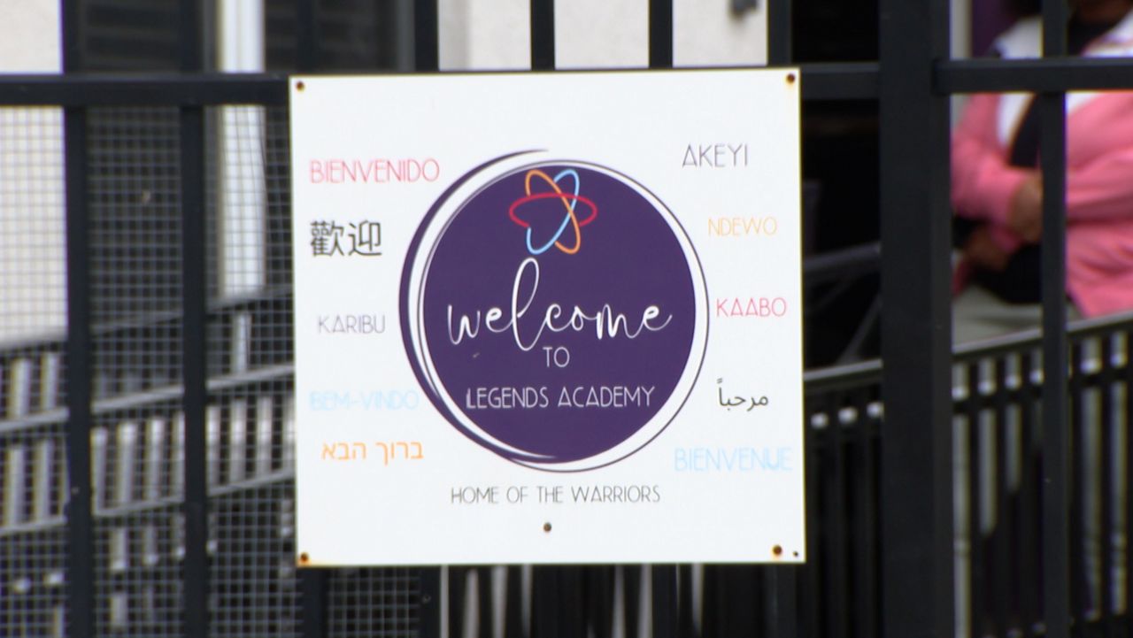 On Monday, parents waited in line one last time to get their final paperwork from Legends Academy. (Spectrum News)