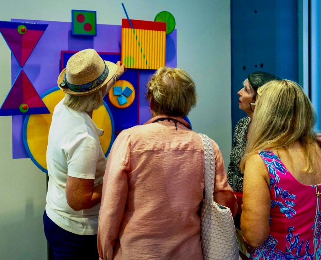 Viewing an interactive art piece. Photo courtesy of Martin Artisans Guild