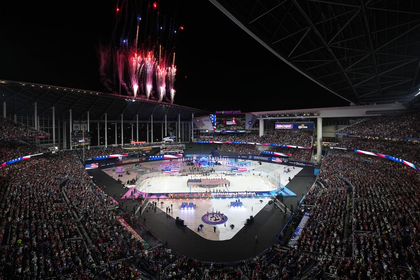 Fireworks explode before the NHL Winter Classic outdoor hockey game between the Florida Panthers and the New York Rangers on Jan. 2, 2026, in Miami.