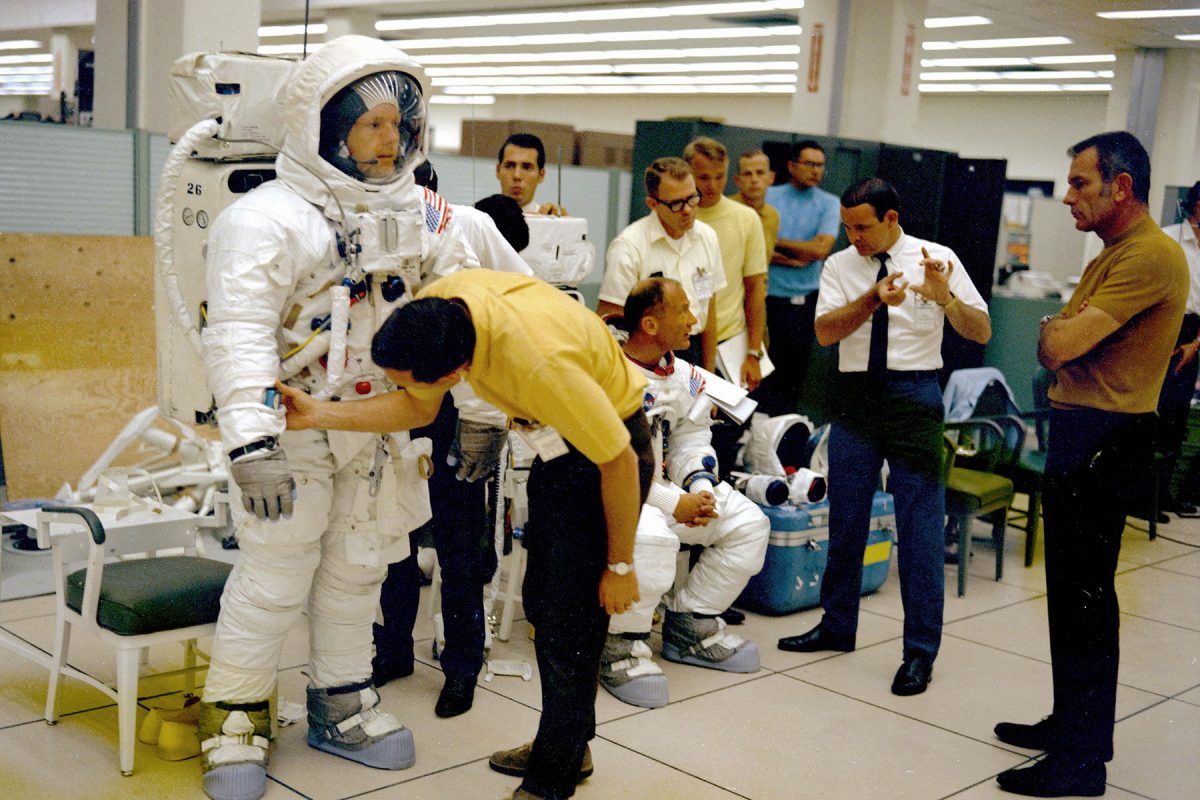 The Apollo 11 flight crew are given instructions by technicians and management while undergoing the Extravehicular Activity (EVA) training and the Lunar Module walk-through in preparation for the first manned landing on the Moon. (NASA)