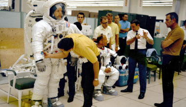 The Apollo 11 flight crew are given instructions by technicians and management while undergoing the Extravehicular Activity (EVA) training and the Lunar Module walk-through in preparation for the first manned landing on the Moon. (NASA)