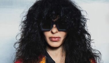 Photo of a woman with black hair wearing glasses.