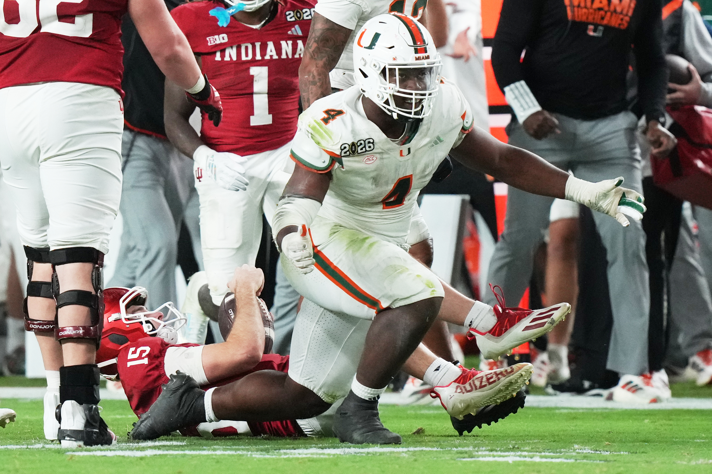 Indiana quarterback Fernando Mendoza is sacked by Miami defensive lineman Rueben Bain Jr. during the second half of the College Football Playoff national championship game, Monday, Jan. 19, 2026, in Miami Gardens, Fla.(AP Photo/Marta Lavandier)