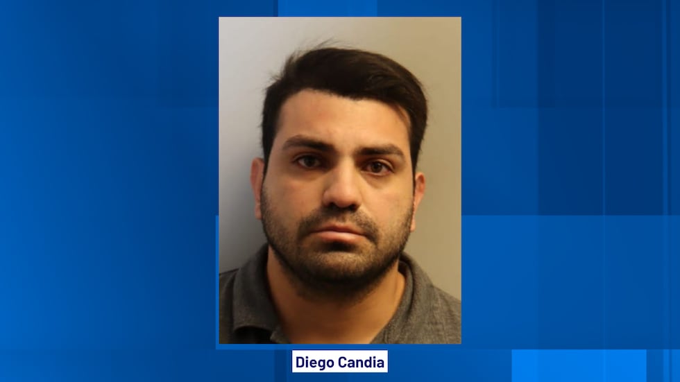 Candia is charged with sexual battery, according to arrest documents