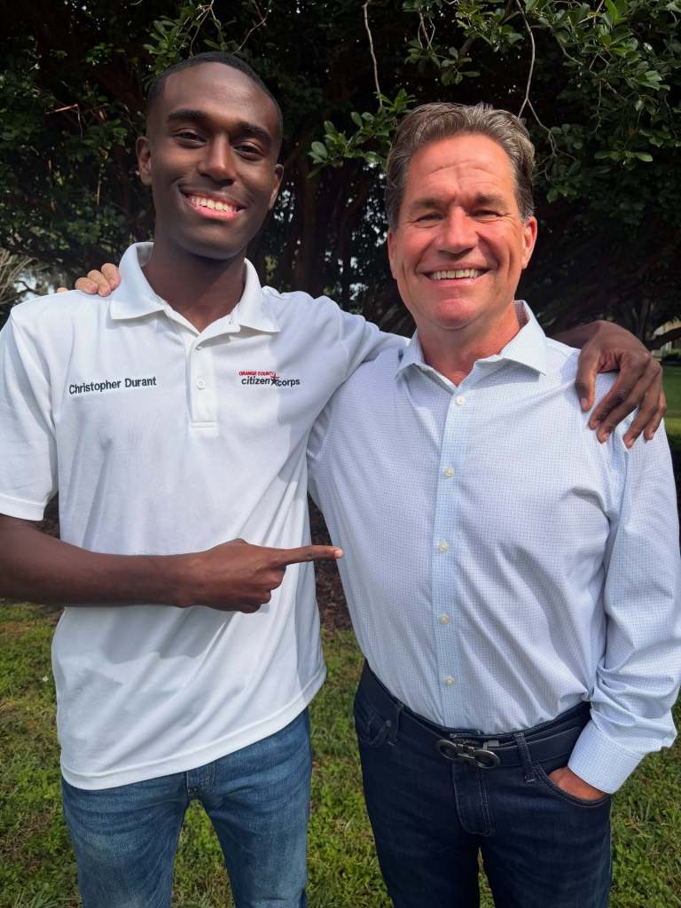 Chris Durant and Roger Chapin with their arms around each other's shoulders