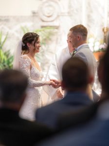 Samantha Williams Travis and Jacob Travis exchange vows. Photo by Tommy Allore