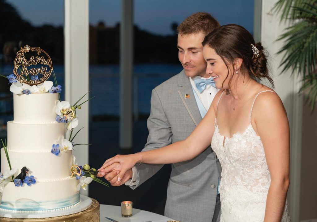 Samantha and Jacob cut their wedding cake, made by Sweet Tiers by Elena Vara. Photo by Tommy Allore
