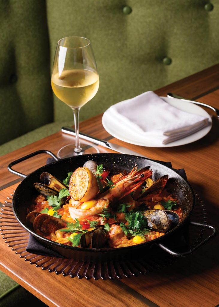 Seafood paella with bomba rice, prawns, mussels, and cuttlefish. Photo by Salar Abduaziz