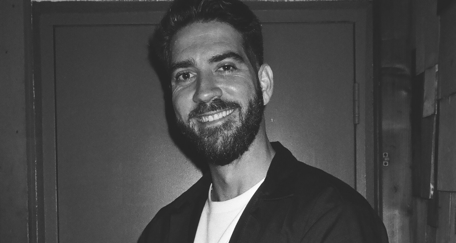 black-and-white portrait of comedian Sergio Mendez