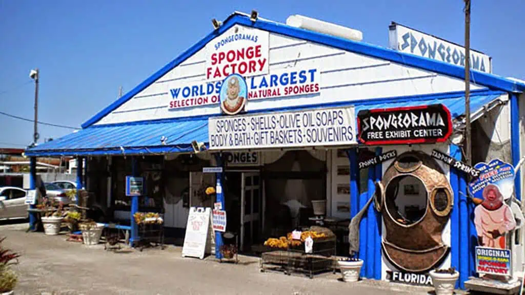 exterior of a white and blue roadside attraction: The Sponge Factory - named a top Labor day weekend destination
