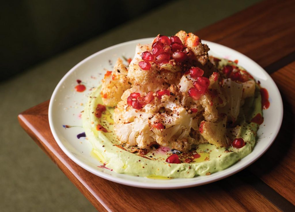 Standout dishes at Sra. Martinez include fire-roasted cauliflower with green tahini and harissa oil. Photo by Salar Abduaziz