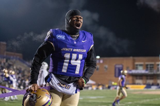 James Madison quarterback Alonza Barnett III (14) celebrates after a touchdown against Troy during the first half of the Sun Belt championship NCAA college football game, on Dec. 5, 2025, in Harrisonburg, Virginia. (Robert Simmons/Associated press)