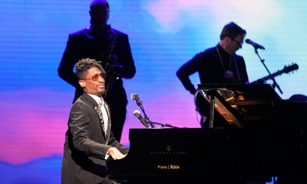 American singer Jon Batiste performs during the opening concert of the Annual Meeting of the World Economic Forum in Davos, Switzerland, Monday, Jan. 19, 2026. (AP Photo/Markus Schreiber)