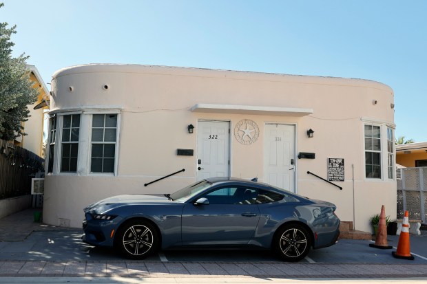 A tiny building at 322-324 Nebraska St. sits between two hotels at Hollywood beach. The building is among 11 properties slated for demolition to make way for a 17-story tower. The developer has filed a lawsuit against the city seeking permission to build. (Amy Beth Bennett/South Florida Sun Sentinel)