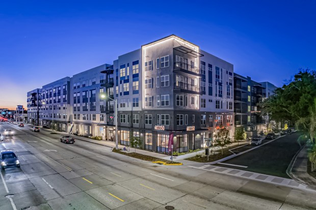 The Alexan Mills 50 apartment community at 1647 E. Colonial Drive in the Mills 50 neighborhood of Orlando has been sold to Evergreen Residential. (Courtesy of IPA)