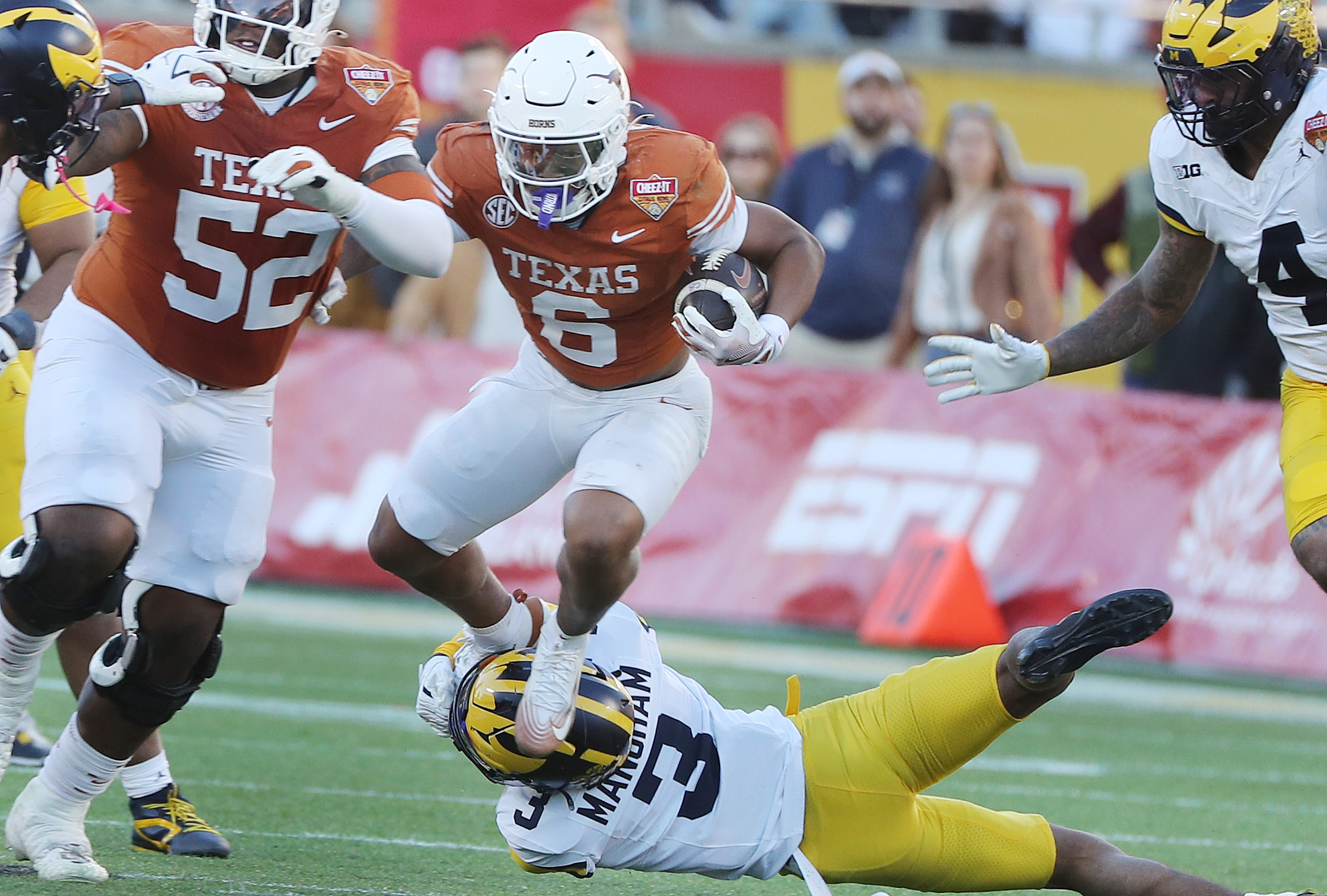 Texas running back Christian Clark (6) leaps during the Cheez-It...