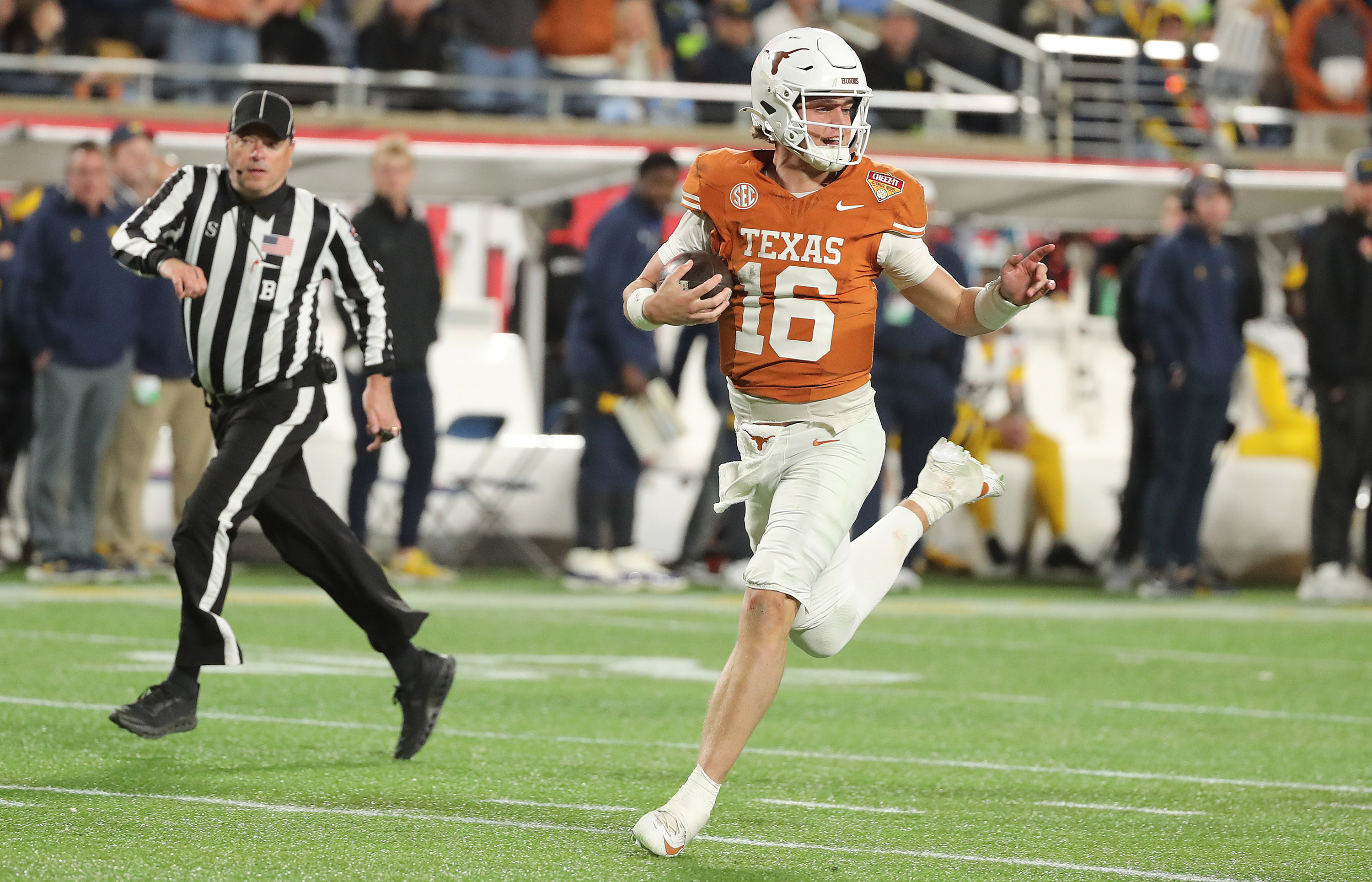 Texas quarterbackk Arch Manning (16) breaks into a smile as...