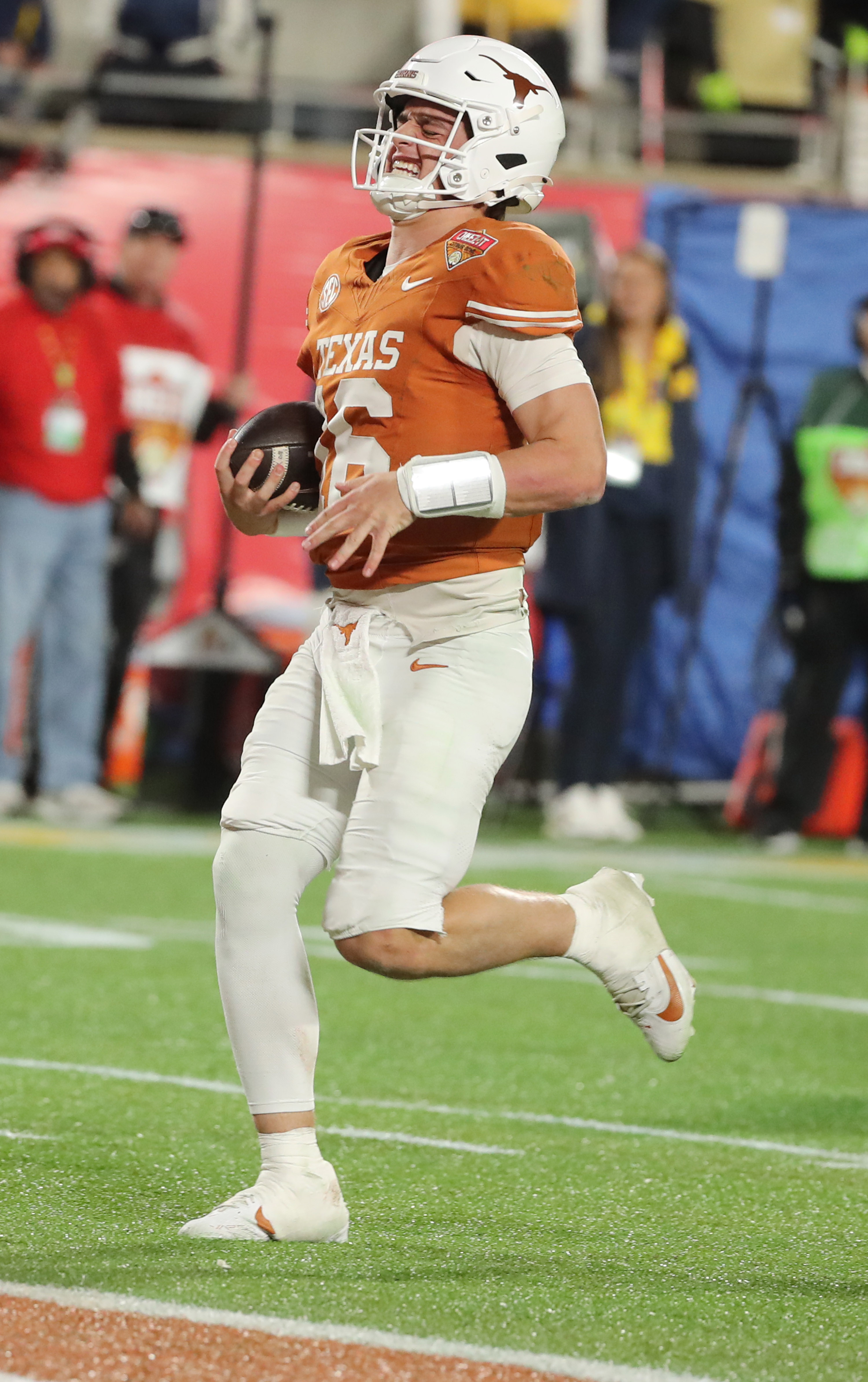 Texas quarterbackk Arch Manning (16) breaks into a smile as...
