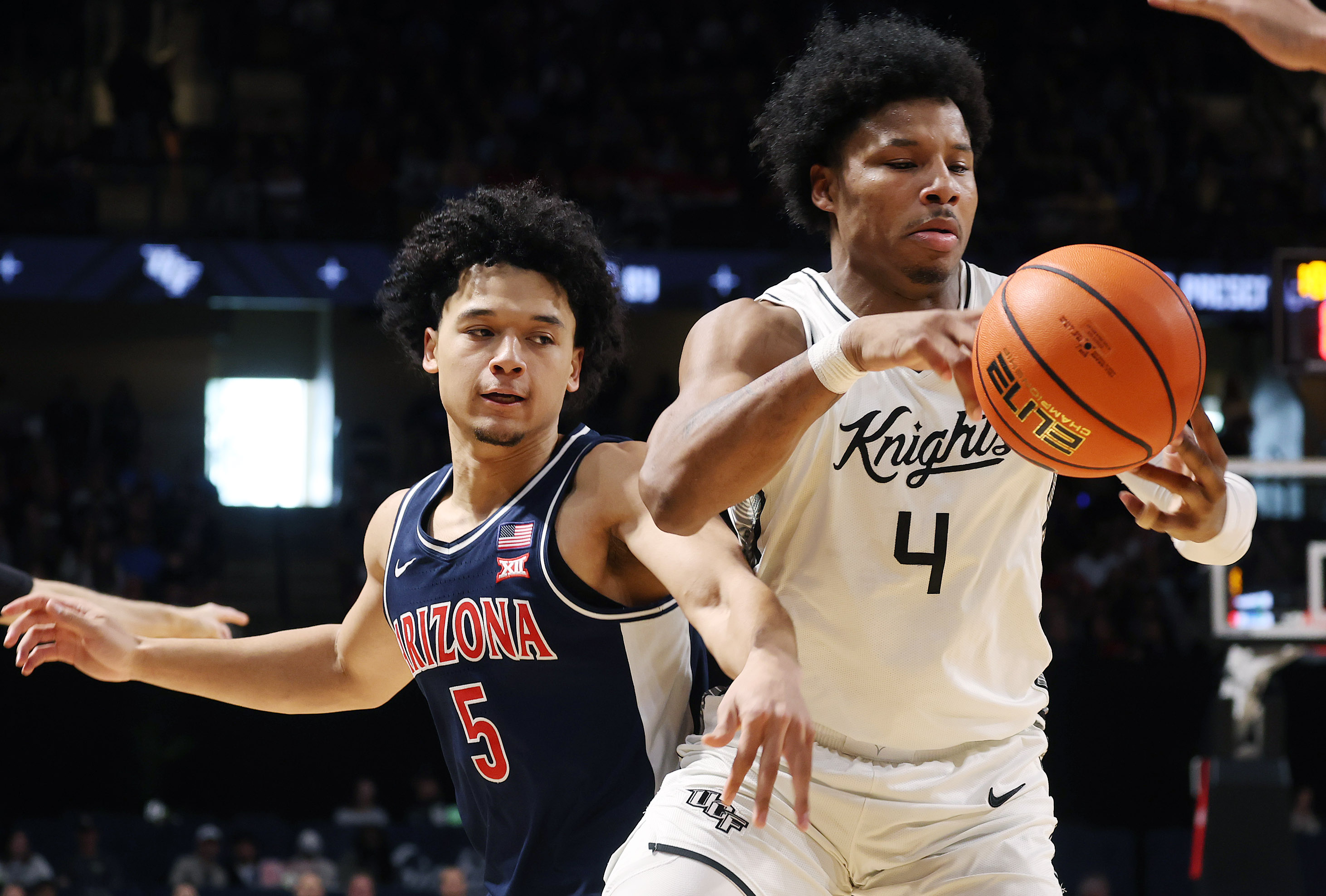 Arizona guard Brayden Burries (5) battles UCF forward Jamichael Stillwell...