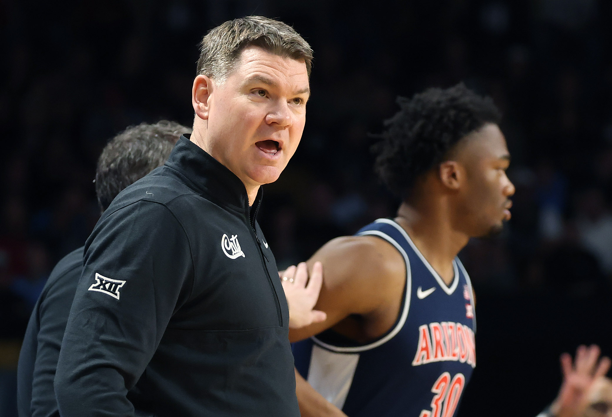 Arizona coach Tommy Lloyd coaches during the Arizona at UCF...