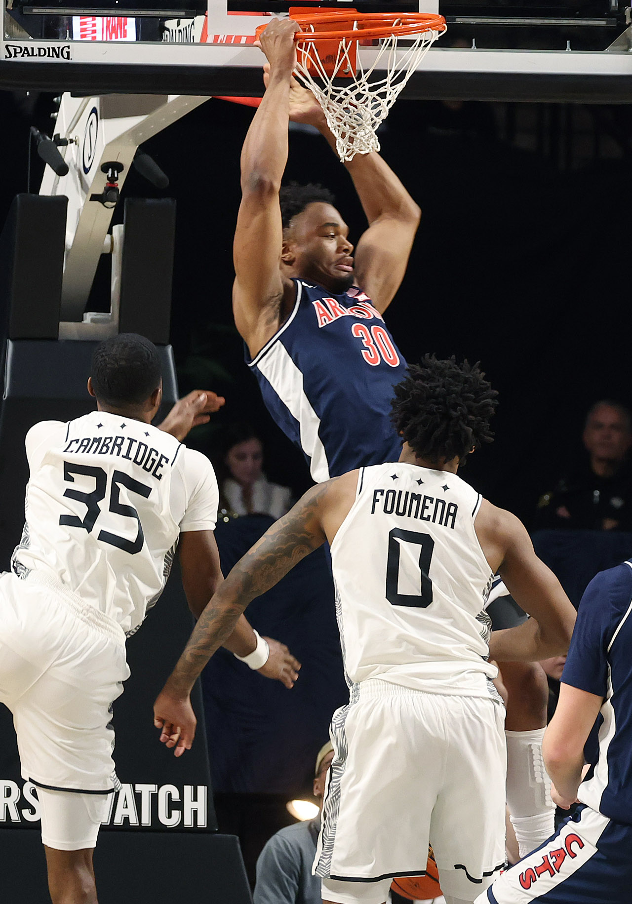 Arizona forward Tobe Awaka (30) finishes a slam dunk during...