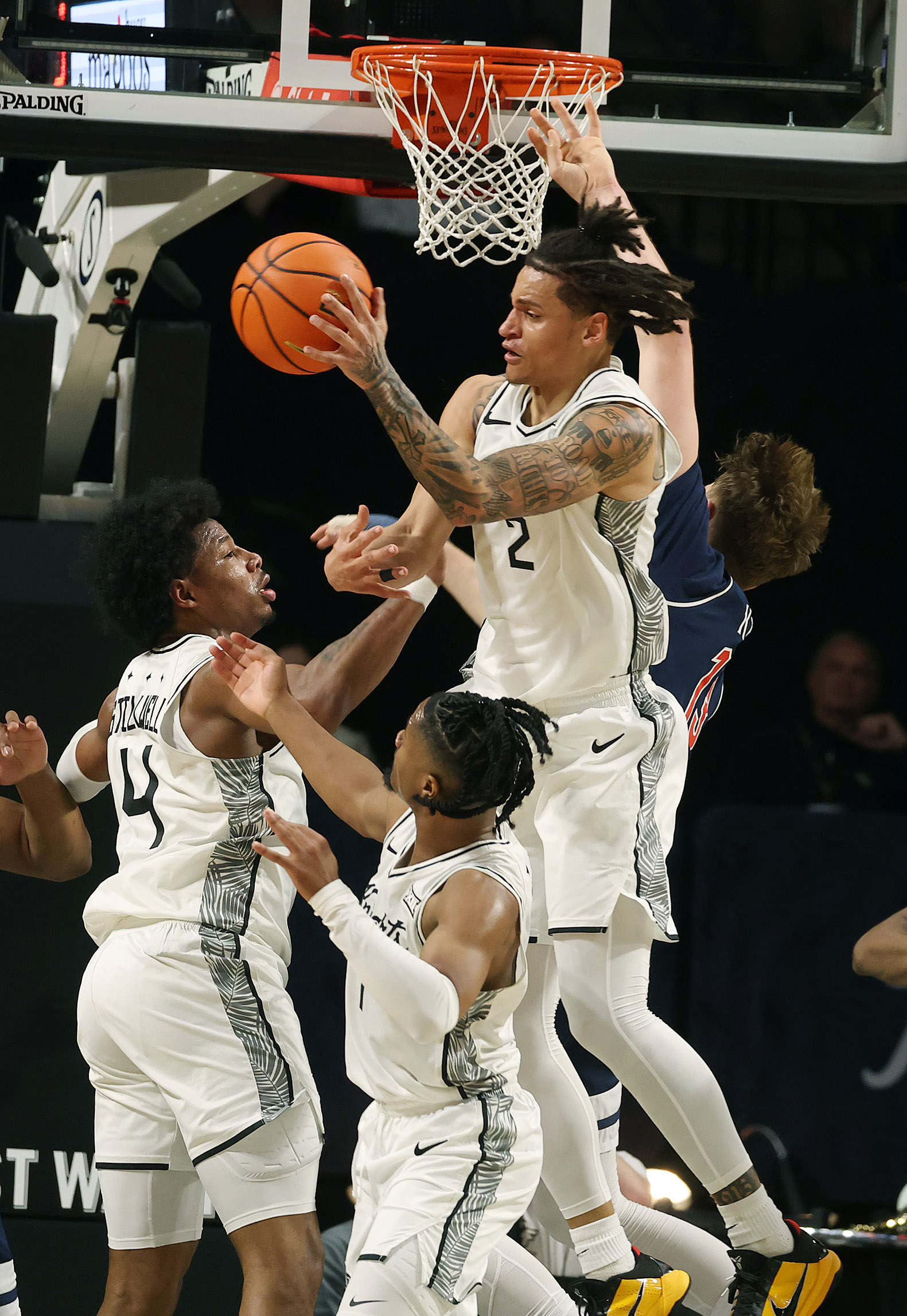 UCF guard Riley Kugel (2) leaps to grab a defensive...