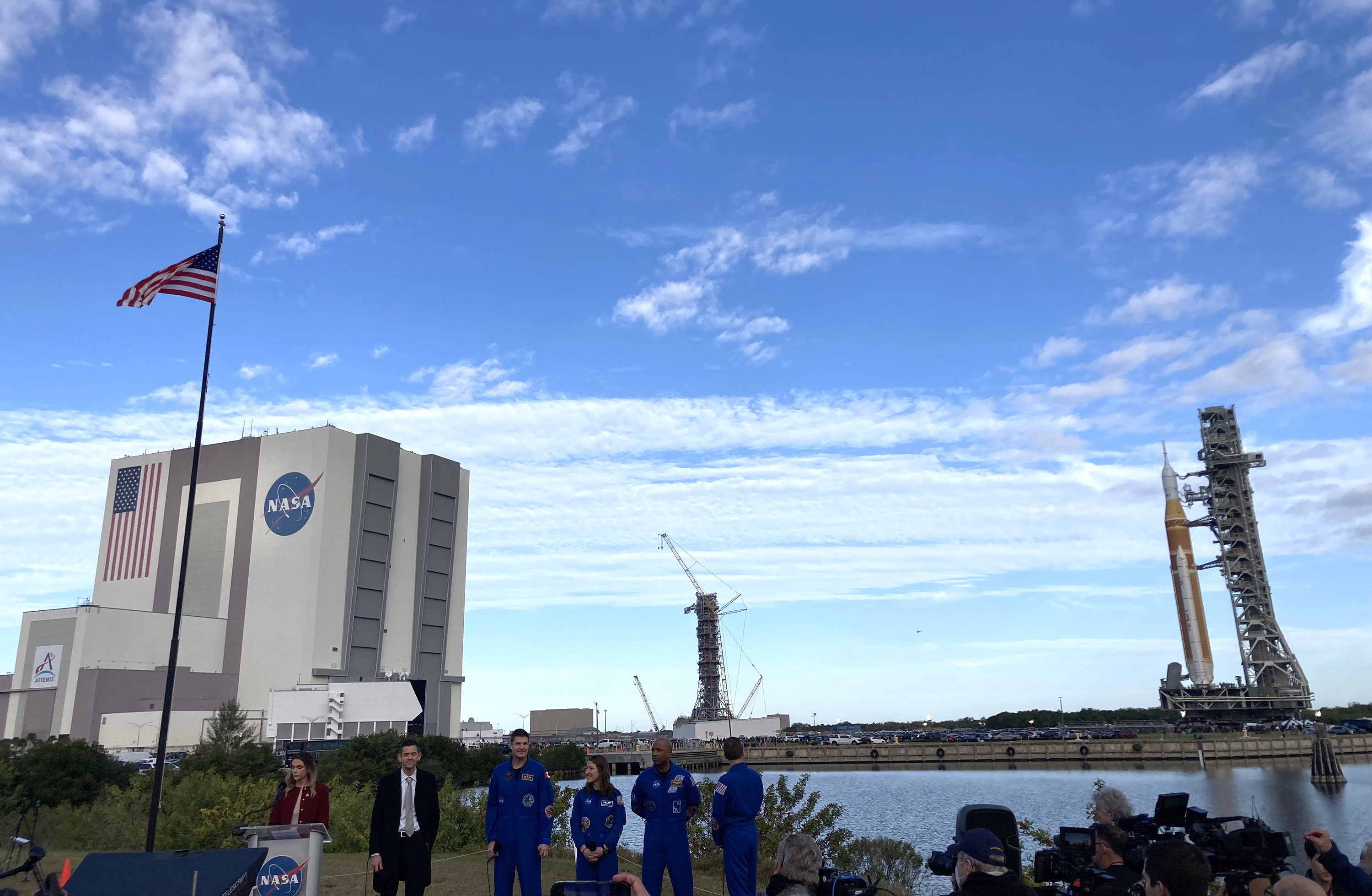 NASA Administrator Jared Isaacman, left, stands with the four astronauts...