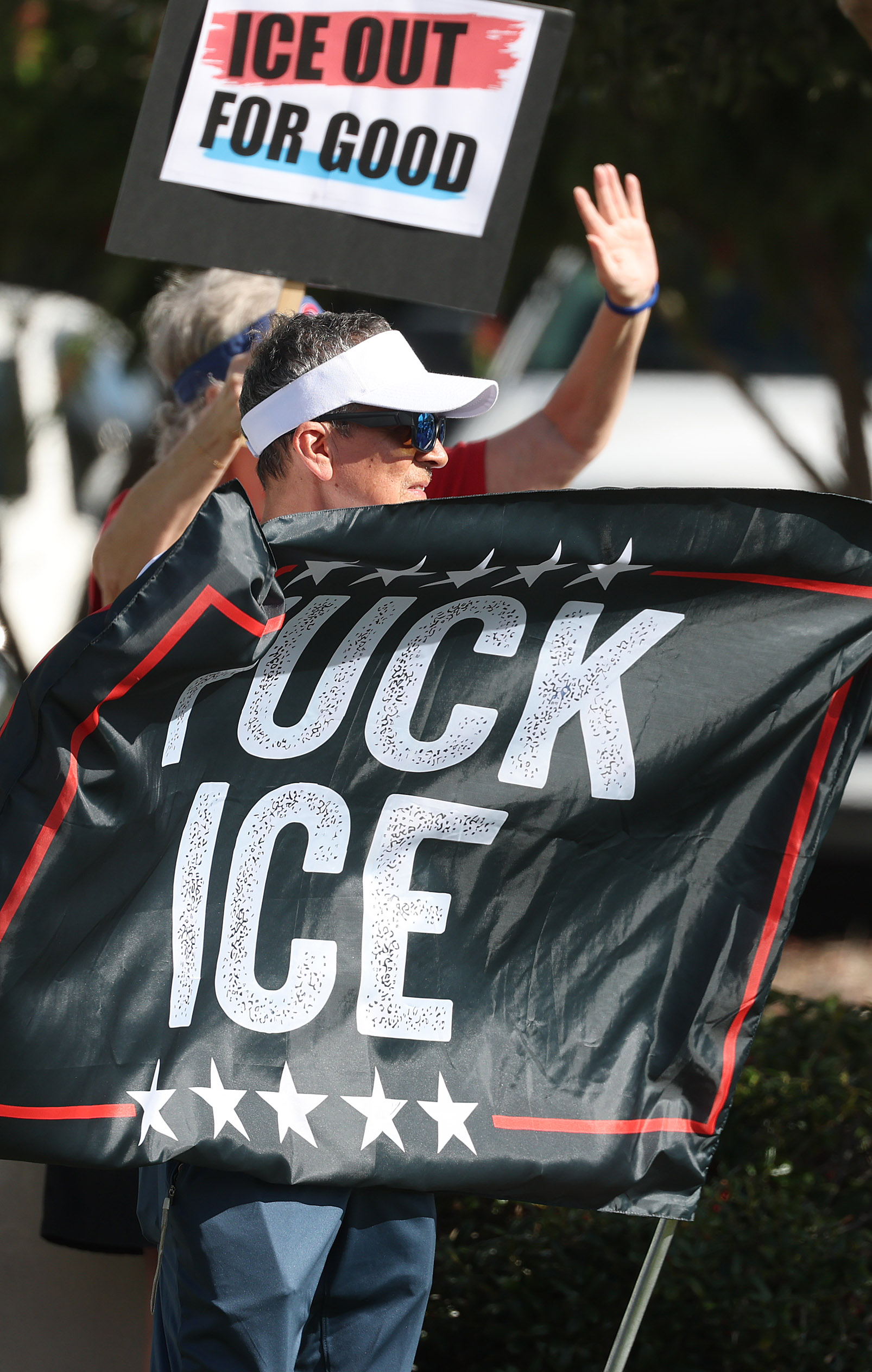 Protestors chant and hold signs during a âIce Out for...