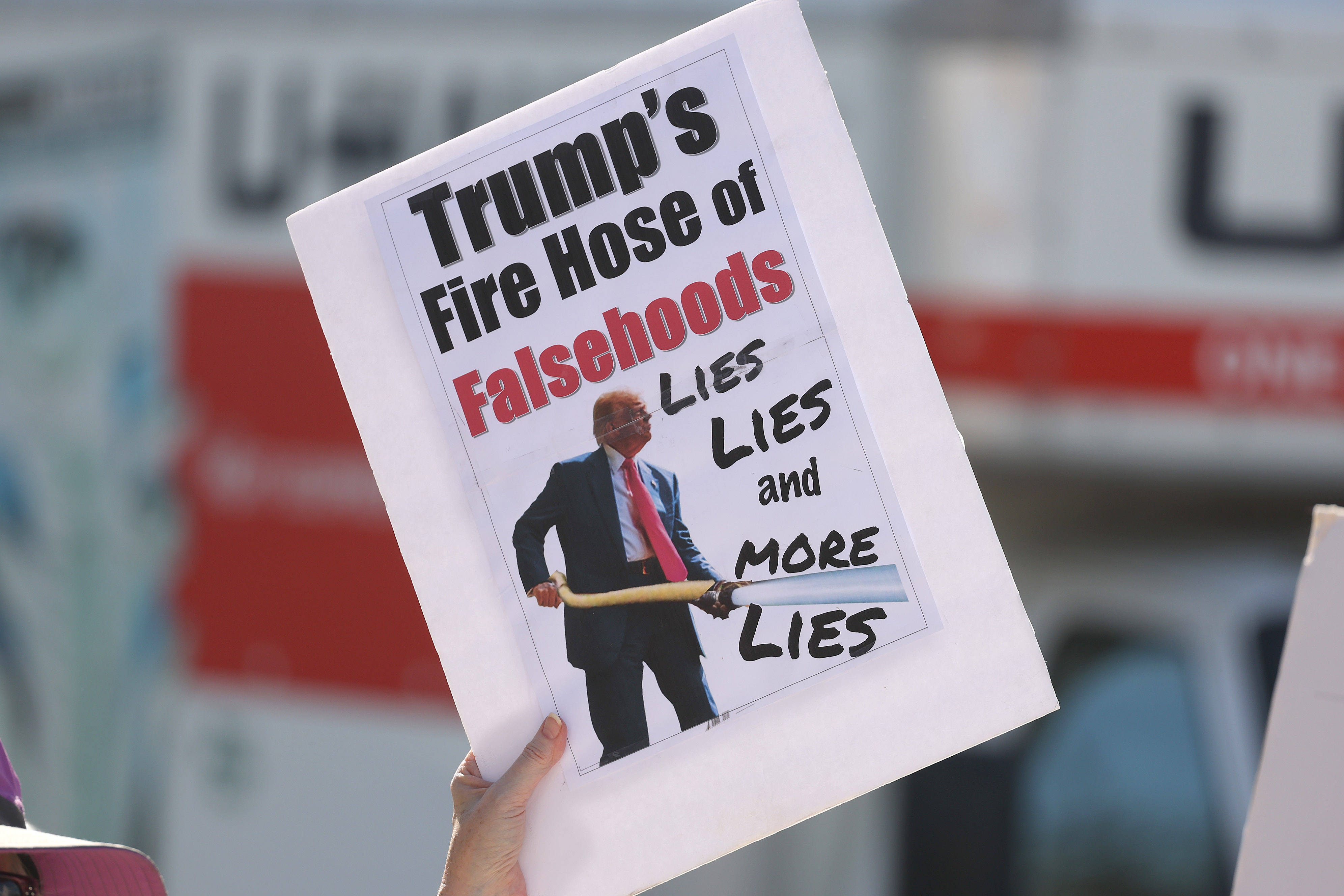 A protestor holds a sign during a âIce Out for...