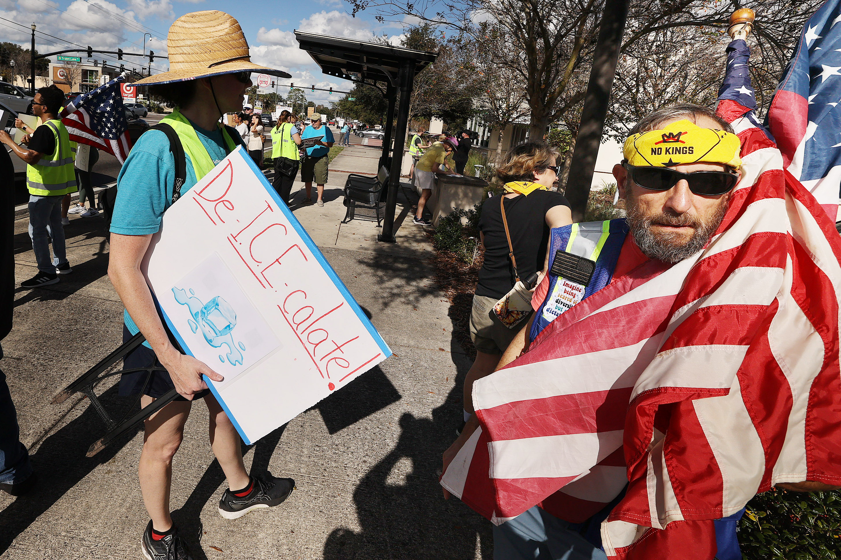 Protestors chant and hold signs during a âIce Out for...
