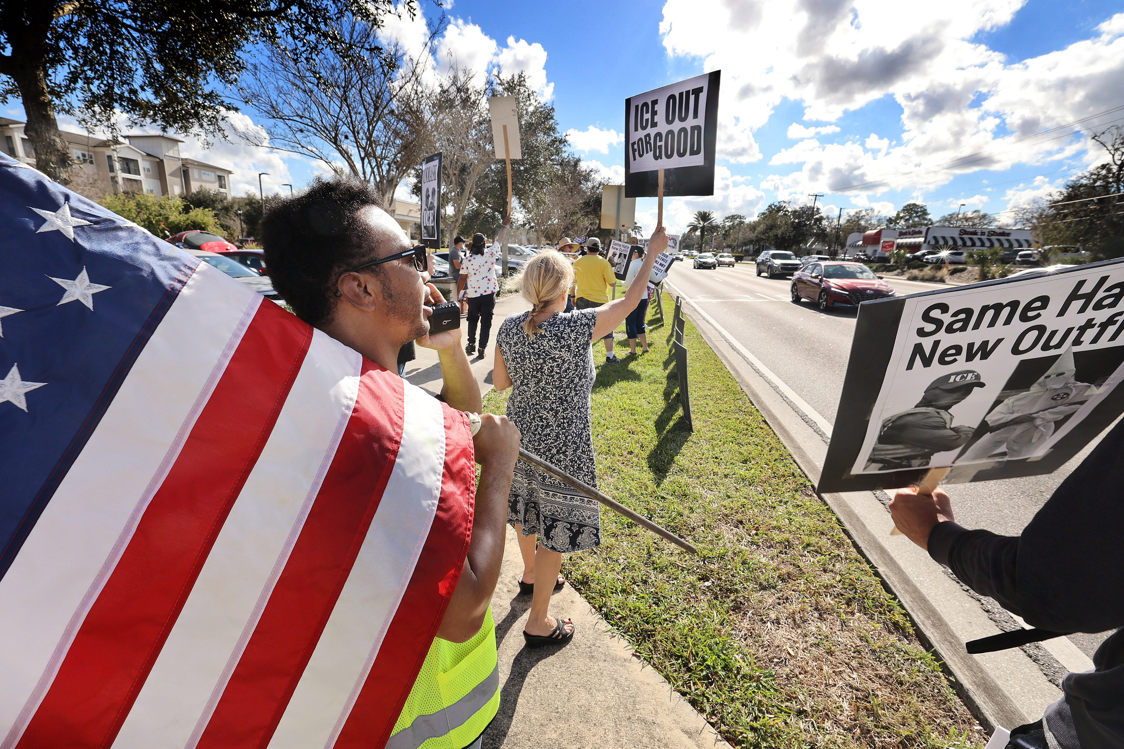 Protestors chant and hold signs during a âIce Out for...