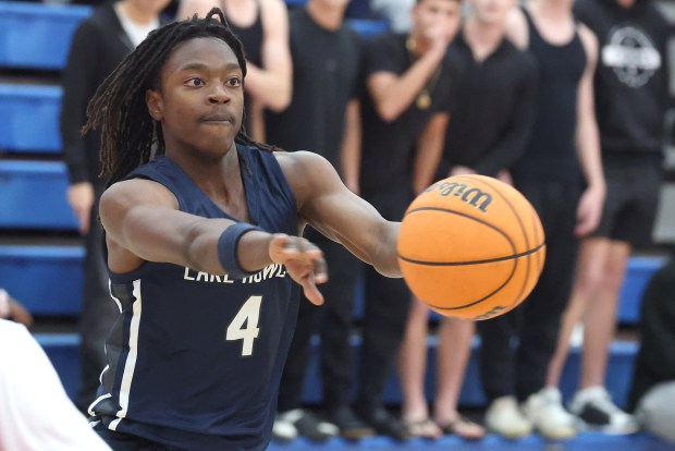 Lake Howell sophomore Johnas Maurice (4) passes in a victory at Lake Brantley on Wednesday. He is averaging 16.7 points and 4.4 assists for the SilverHawks. (Stephen M. Dowell/Orlando Sentinel)