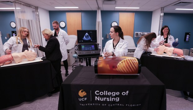 University of Central Florida nursing students work on a lesson in the UCF Simulation, Technology, Innovation and Modeling (STIM) Center on the first day of classes at the new Dr. Phillips Nursing Pavilion at the school's Academic Health Sciences Campus at Lake Nona, July 18, 2025. The 90,000 square-foot, state-of-the-art facility increases capacity for nursing student graduates by 150 annually. (Joe Burbank/Orlando Sentinel)