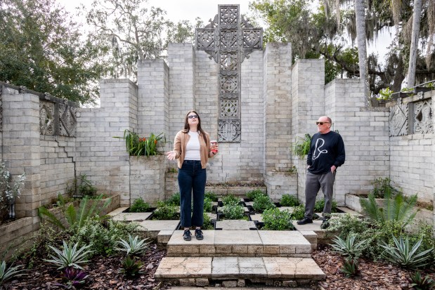 Exhibitions manager Katie Benson leads a tour next to chief curator Dan Hess during a "Sort of Brutally Early" art field trip at the Art and History Museums of Maitland on Dec. 17, 2025. (Patrick Connolly/Orlando Sentinel)