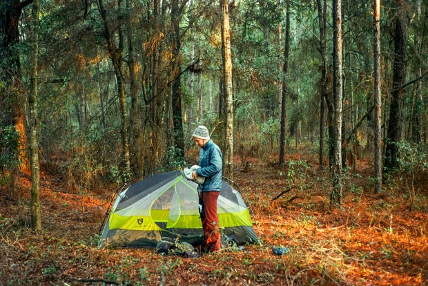 Patrick Connolly works on packing up camp on the third day of a bike ride across Florida on Feb. 17, 2025. (Courtesy of Ben Chalone)