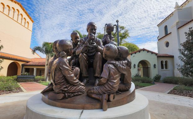 The Mister Rogers sculpture on the Rollins College campus in Winter Park, Tuesday, Dec. 20, 2025, honoring famed alumnus and children's TV show host Fred Rogers. The statue was installed on campus in 2021. (Joe Burbank/Orlando Sentinel)