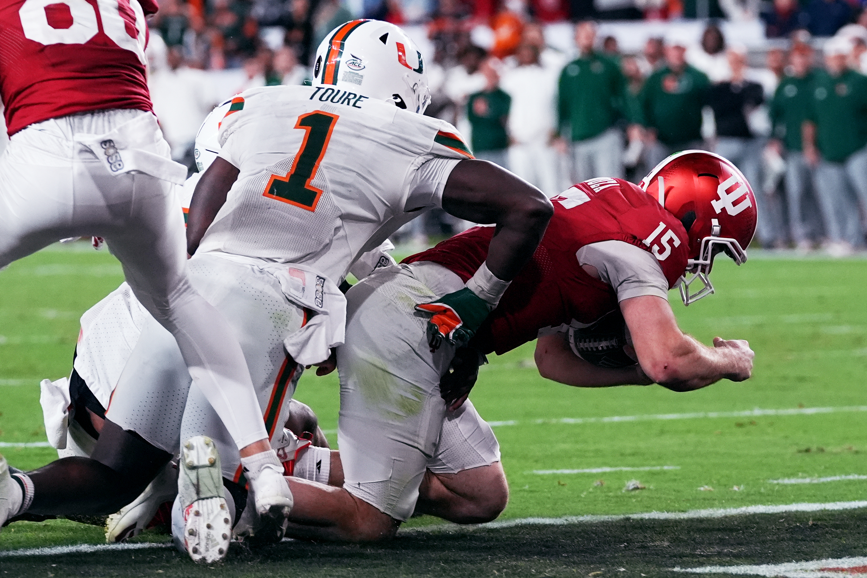 Indiana quarterback Fernando Mendoza scores against Miami during the second half of the College Football Playoff national championship game, Monday, Jan. 19, 2026, in Miami Gardens, Fla. (AP Photo/Marta Lavandier)