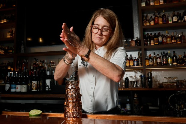 Owner Deanne Crosby mixes a "Davie Jones' Locker" cocktail which contains Flor de Caña 4 year and Hamilton Jamaican Pot Still rums, golden falernum, orgeat syrup, passionfruit, demerara and bitters at Black Jack's Rum Bar & Grille in the Flagler Village neighborhood of Fort Lauderdale on Monday, Jan. 26, 2026. (Amy Beth Bennett / South Florida Sun Sentinel)
