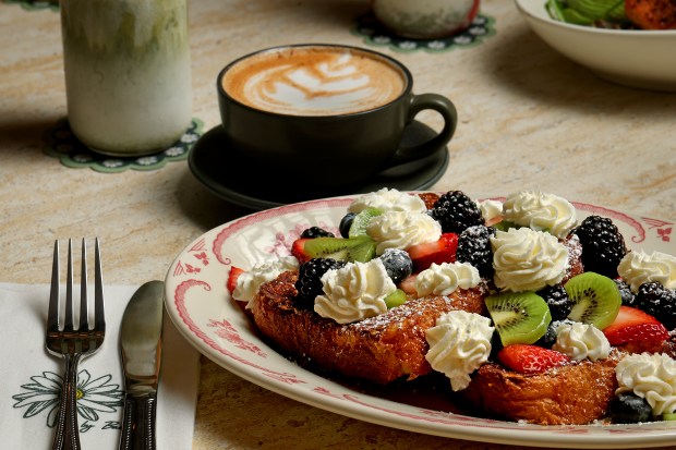 The classic French toast topped with kiwi, berries, and butter whipped cream is served at Cafe Bastille in the Weston Town Center, Thursday, Jan. 15, 2026.