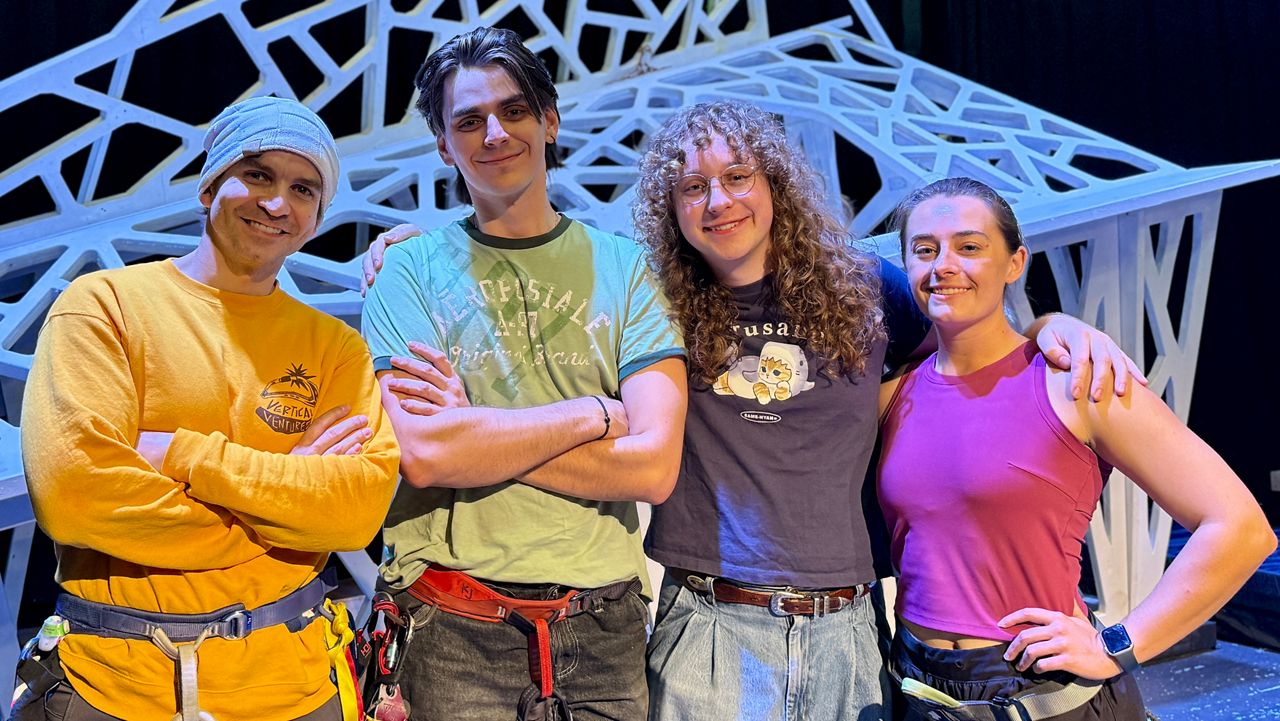 L-R Luis Rivera, Robert Logan Mays, Seth Henley-Beasley and Brianna McVaugh: cast members of Stageworks Theatre's upcoming show "Touching the Void," in front of their mountain set. (Spectrum News/Virginia Johnson)