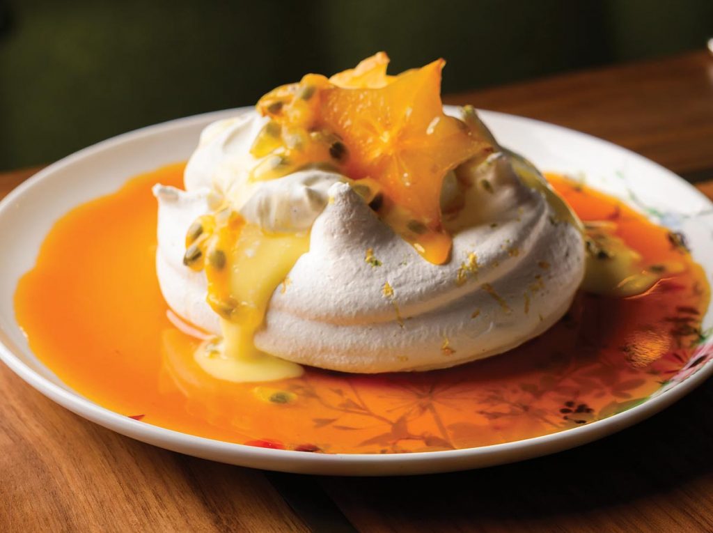 Tropical pavlova with passion fruit caramel and citrus curd. Photo by Salar Abduaziz