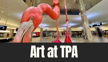 Large pink flamingo sculpture inside Tampa International Airport terminal