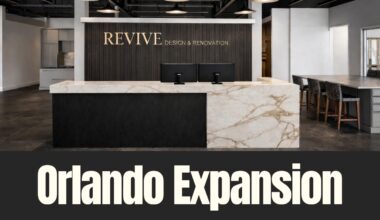Revive Design and Renovation’s new Orlando showroom interior featuring a marble reception desk and design workspace