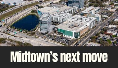 Aerial view of Midtown Tampa showing the retail core anchored by Whole Foods Market, surrounded by offices, apartments and major roadways in Tampa.