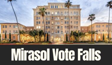 The Mirasol building on Davis Islands, a historic waterfront apartment complex proposed for boutique hotel conversion, photographed at dusk.