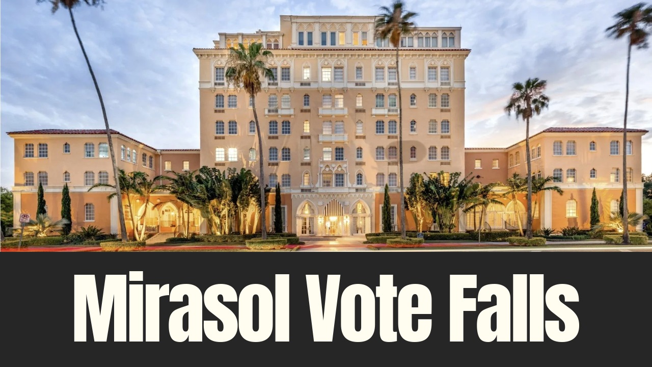 The Mirasol building on Davis Islands, a historic waterfront apartment complex proposed for boutique hotel conversion, photographed at dusk.