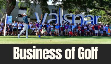 Golfer tees off at the Valspar Championship with spectators lined behind the fairway signage in Tampa Bay.