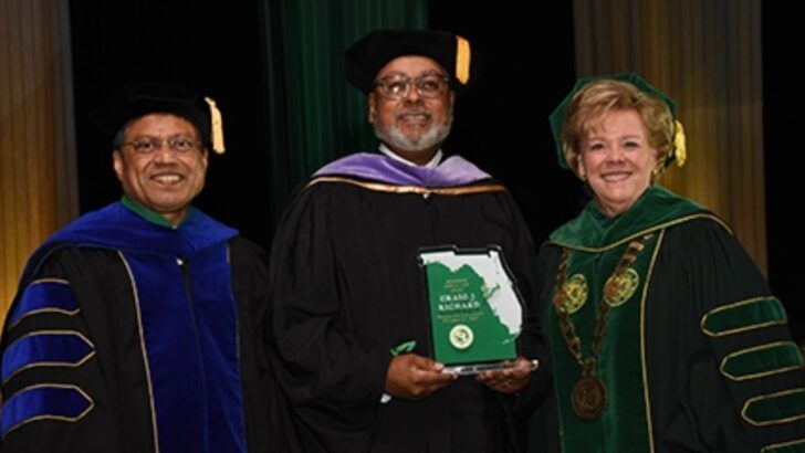 Craig J. Richard, president and CEO of the Tampa Bay Economic Development Council, receives the University of South Florida Distinguished Citizen Award during the university’s commencement ceremony